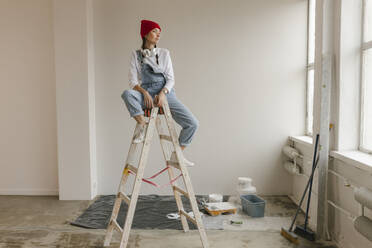 Gdansk, Poland, woman making renovations in her new apartment and dreams - VIVF01284