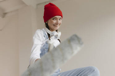 Gdansk, Poland, woman making renovations in her new apartment and dreams - VIVF01288