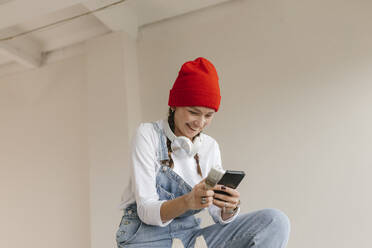 Gdansk, Poland, woman making renovations in her new apartment and dreams - VIVF01289