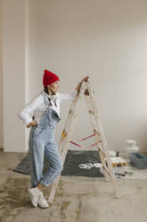 Gdansk, Poland, woman making renovations in her new apartment and dreams - VIVF01290