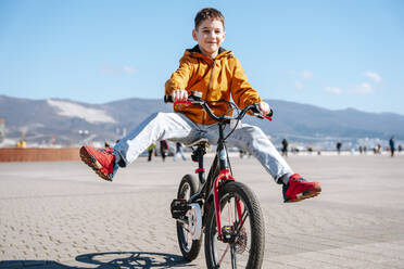 Russia.Krasnodar. A boy rides a bike - NLAF00381