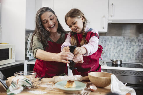 grandmother with granddaughter at home spending free time. Madrid/Spain - JCCMF11545