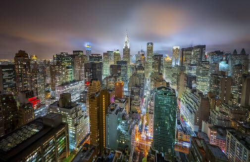 Aerial view of Manhattan skyline at night, New York, United States. - AAEF28090