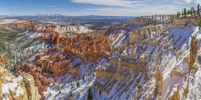 Aerial view of red rock formations with snowy winter landscape, Utah, United States. - AAEF28108