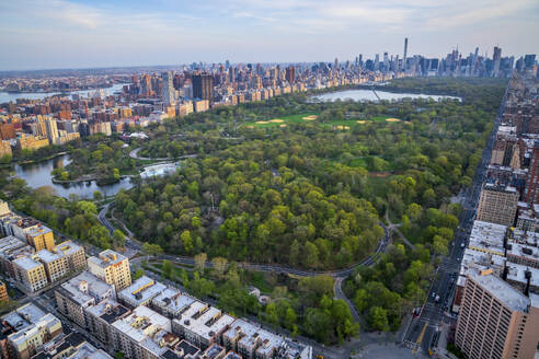 Aerial view of Central Park in Manhattan, New York with beautiful sunset over the metropolitan skyline, New York, United States. - AAEF28112