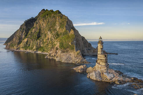 Aerial view of Aniva Lighthouse and Cape with beautiful coastal line, Aniva, Sakhalin Oblast, Russia. - AAEF28191