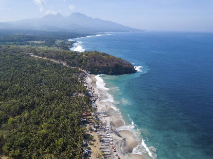 Aerial View of Virgin Beach with a row of outrigger boats, Padang Bai, Karangasam, Bali, Indonesia. - AAEF28273
