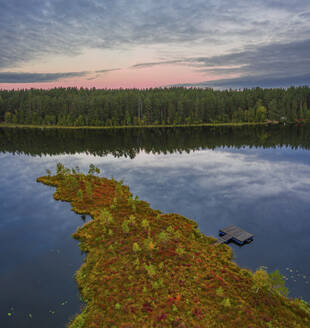 Aerial view of Vodlozero National Park in twilight sunset with calm water and autumn foliage, Gromovskoe, Karelia, Russia. - AAEF28409