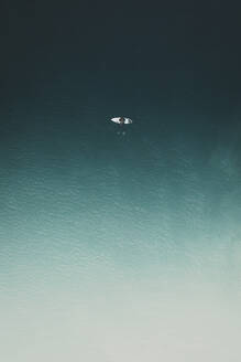 Aerial view of a surfer relaxing in the calm sea in Portugal. - AAEF28587