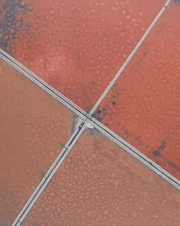 Aerial view of the colored salt flats in Sicily, Italy. - AAEF28625