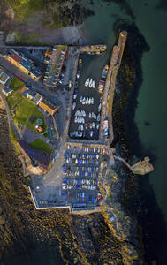 Aerial view of beautiful coastal town with marina, boats, and sunset, North Berwick, Scotland. - AAEF28684