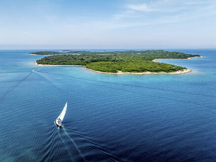 Aerial view of sailing boat near Brijuni National Park islands, Istria, Croatia. - AAEF28694