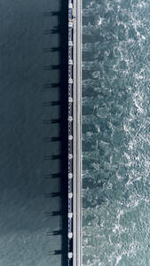 Aerial drone view of storm surge barrier Oosterscheldekering, bridge and water barrier, The Netherlands. - AAEF28733