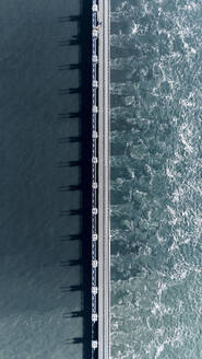 Aerial drone view of storm surge barrier Oosterscheldekering, bridge and water barrier, The Netherlands. - AAEF28733