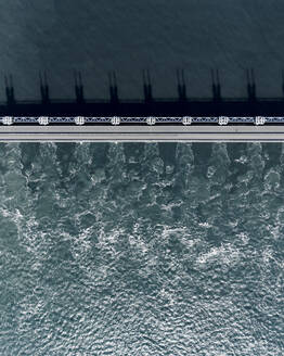 Aerial drone view of storm surge barrier Oosterscheldekering, bridge and water barrier, The Netherlands. - AAEF28734