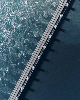 Aerial drone view of storm surge barrier Oosterscheldekering, bridge and water barrier, The Netherlands. - AAEF28736