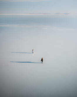 Aerial drone view of people at salt flats in Uyuni salt lake, Bolivia. - AAEF28739