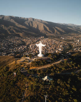 Aerial drone view at sunset of the Christ of Peace in San Pedro Hill, Cochabamba, Bolivia. - AAEF28743