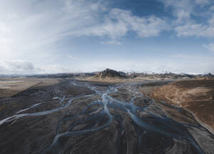 Aerial view of a braided river leading up to a mountain near Vik, Iceland. - AAEF28767