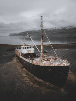 Aerial view of the Gardar BA 64 shipwreck laying on the Patreksfjordur fjord shoreline, Westfjords, Iceland. - AAEF28782