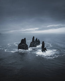 Aerial view of Reynisdrangar sea stacks near Vik, Iceland. - AAEF28785