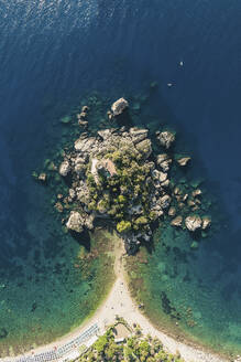 Aerial view of an island with a house on top in Taormina, Sicily, Italy. - AAEF28861