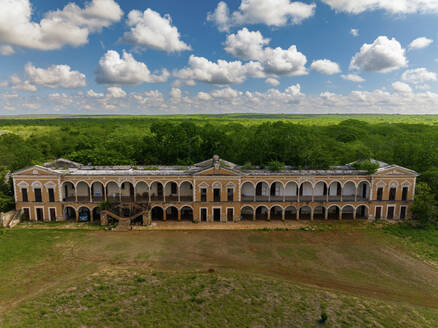 Aerial view of abandoned Hacienda Tabi with arches and colonial facade, Ticul, Yucatan, Mexico. - AAEF28963