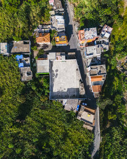 Aerial drone top-down view of a soccer field in a small village, Faja de Cima on Santo Antao island, Cape Verde. - AAEF29123