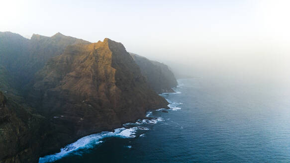 Aerial drone view of coastline and cliffs near Fontainhas during sunrise, North of Santo Antao island, Cape Verde. - AAEF29146