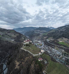 Aerial view of Klausen town with Sabiona Monastery, South Tyrol, Italy. - AAEF29321