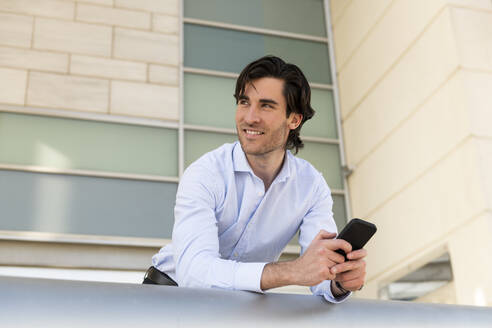 Spain, Young businessman outdoors, Business - LMCF01047