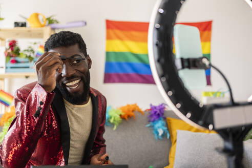 African American non-binary person, at home prepared for gay pride party. Madrid/ Spain - JCCMF11650