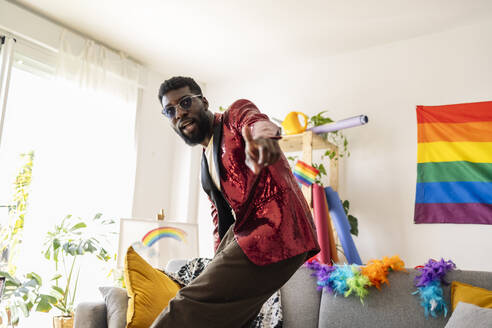 African American non-binary person, at home prepared for gay pride party. Madrid/ Spain - JCCMF11658