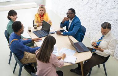 Multiethnic corporate business team working in the office - OIPF04201