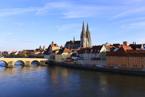 Germany, Bavaria, Regensburg, Medieval old town with river in foreground - JTF02420