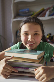 USA. NY, Cute carefree girl at home with school books - AZF00608