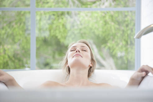 Woman Relaxing in Bathtub - FSIF07018