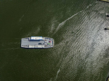 Aerial view of a boat cruising on glistening waters - ISF27301