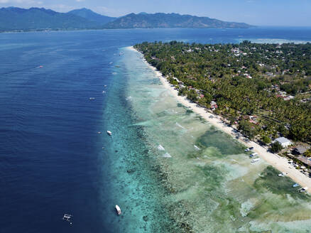 Aerial view of a tropical coastline with clear blue water - ISF27315